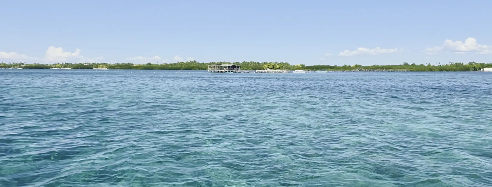 Cebu Olango Half-Day Hopping Tour — calm turquoise waters near the floating cottage at Olango Island