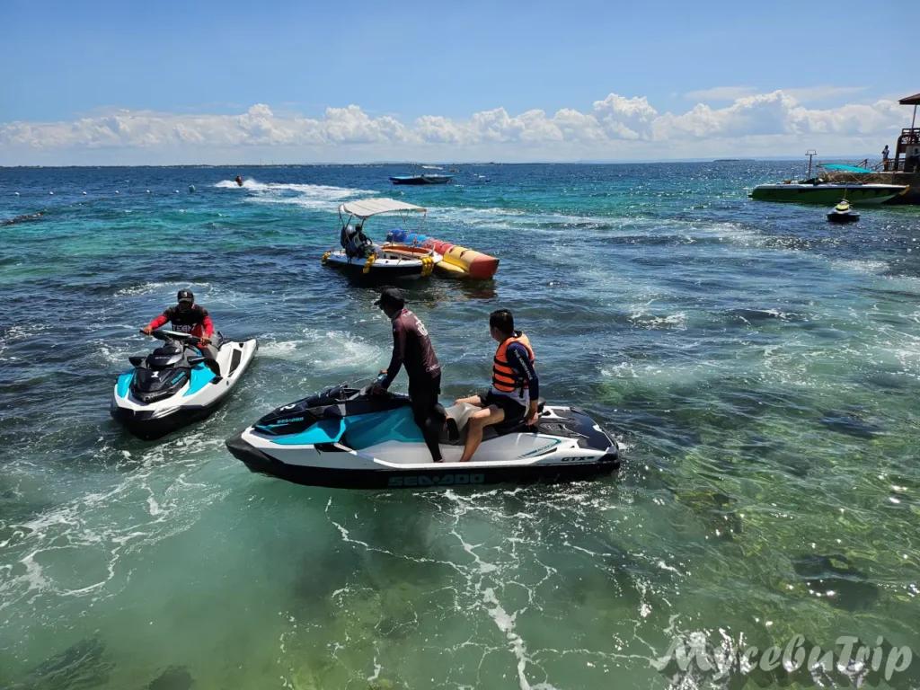 A jet ski guide accompanying a tourist during a guided ride in Mactan, Cebu